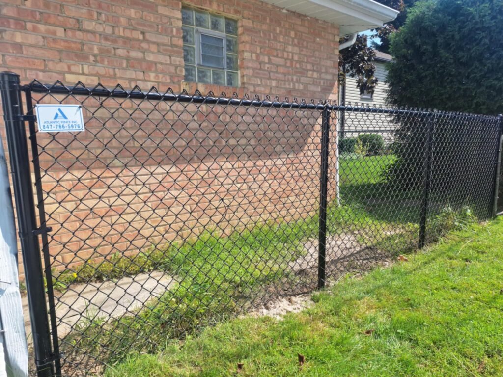 4FT TALL BLACK CHAIN-LINK FENCE.